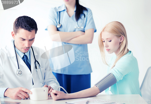 Image of doctor and patient in hospital