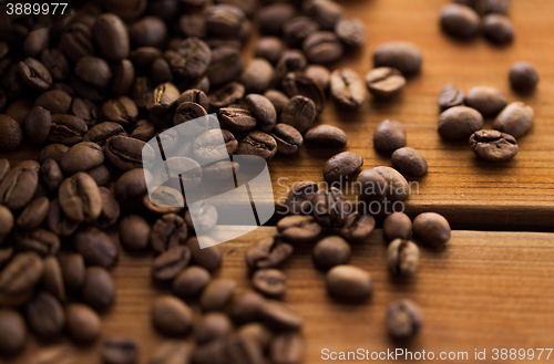 Image of close up coffee beans on wooden table