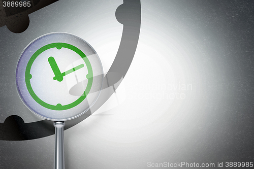 Image of Time concept:  Clock with optical glass on digital background