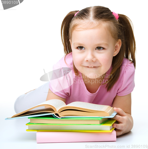 Image of Little girl is reading a book