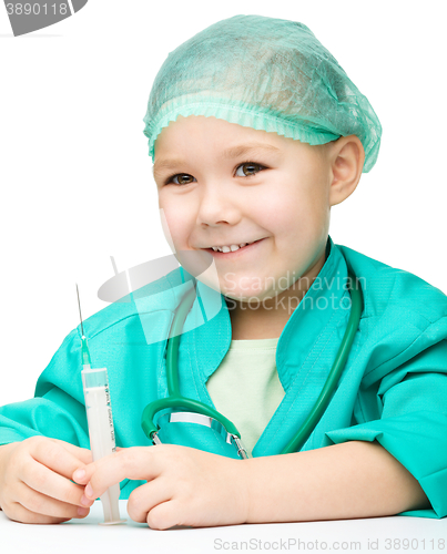 Image of Cute little girl is playing doctor with syringe