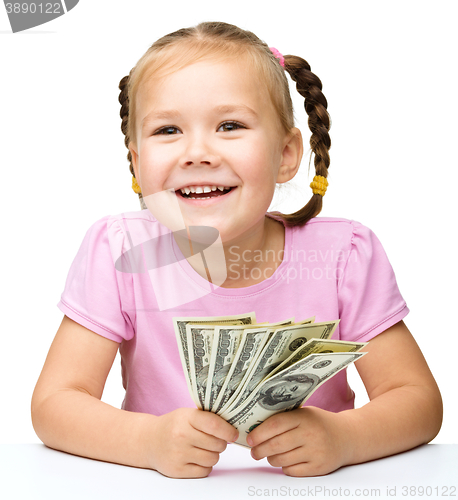 Image of Little girl with dollars