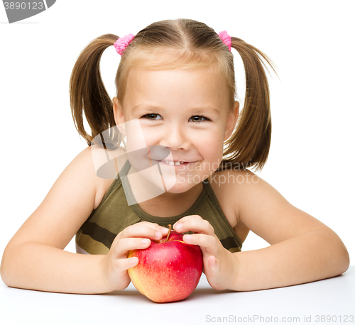 Image of Little girl with red apple