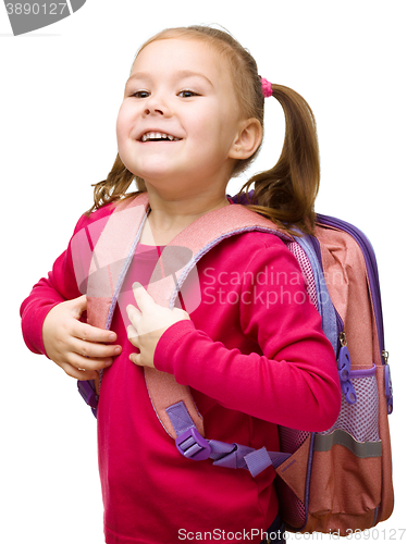 Image of Portrait of a cute little schoolgirl with backpack