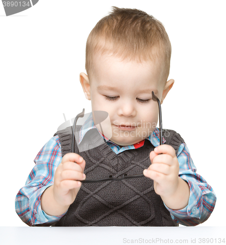 Image of Portrait of a cute little boy wearing glasses