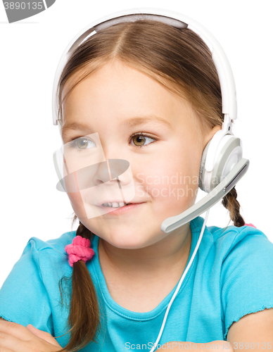 Image of Young girl is working as an operator at helpline