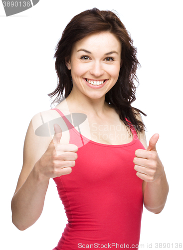 Image of Woman is showing thumb up gesture