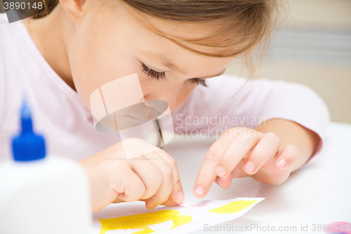 Image of Little girl doing arts and crafts in preschool