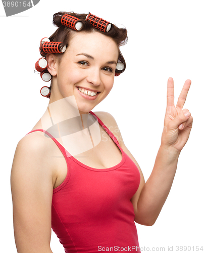 Image of Woman is showing victory sign