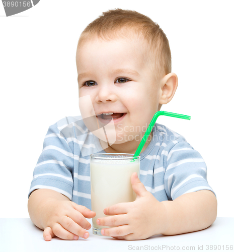 Image of Cute little boy with a glass of milk