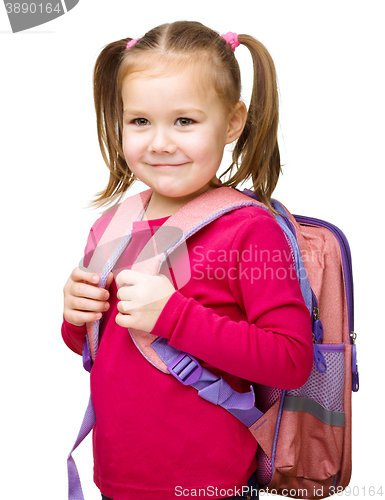 Image of Portrait of a cute little schoolgirl with backpack