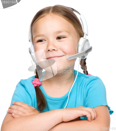 Image of Young girl is working as an operator at helpline