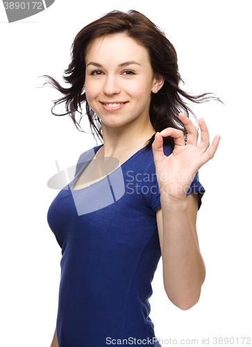 Image of Woman is showing OK sign