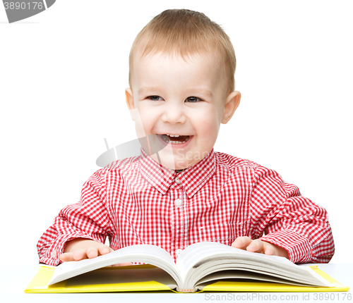 Image of Little child play with book