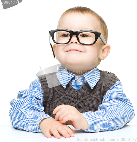 Image of Portrait of a cute little boy wearing glasses