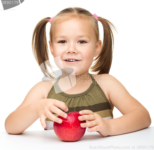 Image of Little girl with red apple