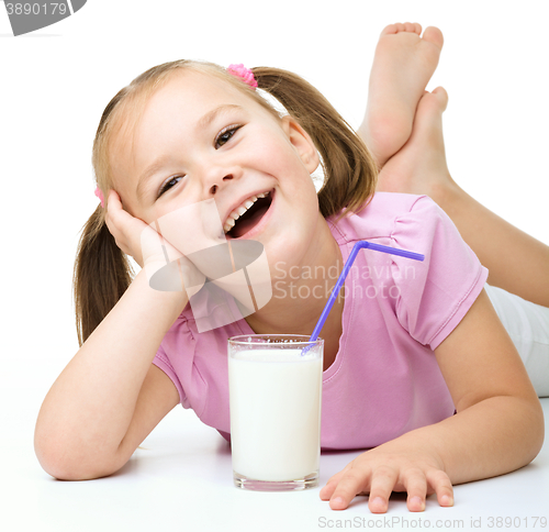Image of Cute little girl with a glass of milk