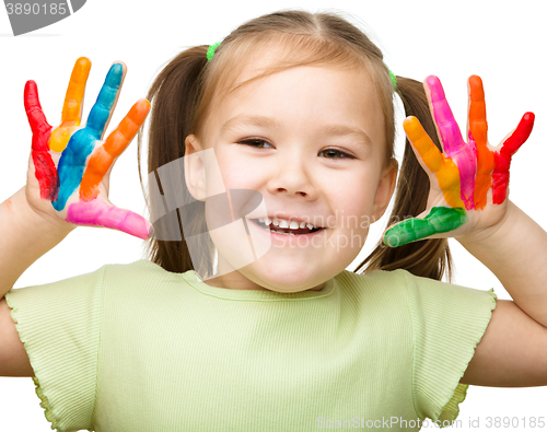 Image of Portrait of a cute girl playing with paints