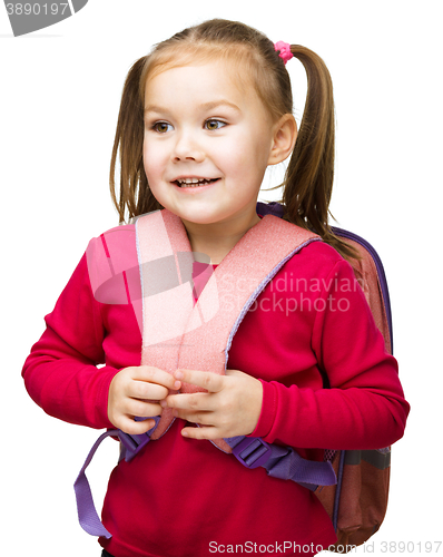 Image of Portrait of a cute little schoolgirl with backpack