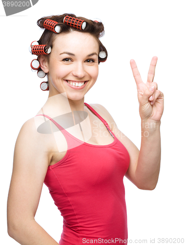 Image of Woman is showing victory sign