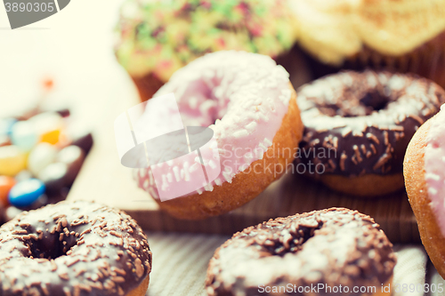 Image of close up of glazed donuts pile on table