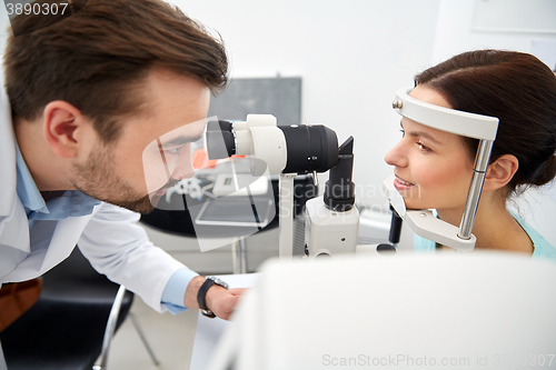 Image of optician with tonometer and patient at eye clinic