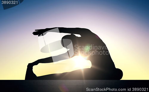 Image of woman doing exercises on stairs over sun light