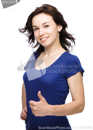 Image of Woman is showing thumb up gesture