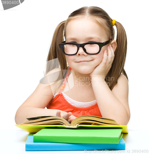 Image of Little girl is reading a book