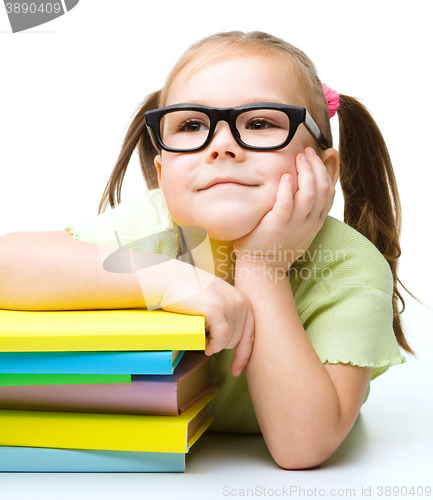 Image of Little girl with books