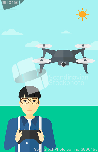 Image of Man flying drone.