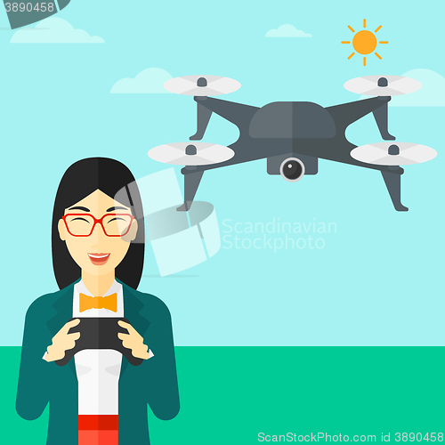 Image of Woman flying drone.