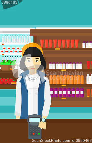 Image of Woman paying with smart watch.