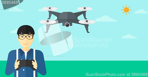 Image of Man flying drone.