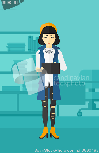 Image of Woman using tablet computer.