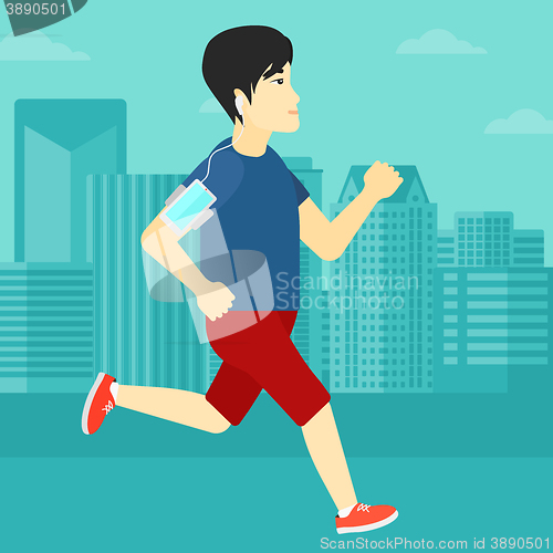 Image of Man jogging with earphones and smartphone.