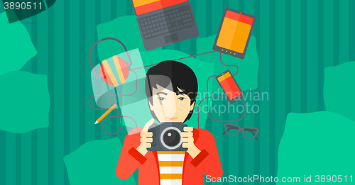 Image of Man holding camera.