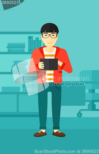 Image of Man using tablet computer.