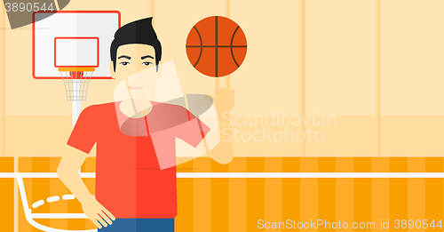 Image of Basketball player spinning ball.