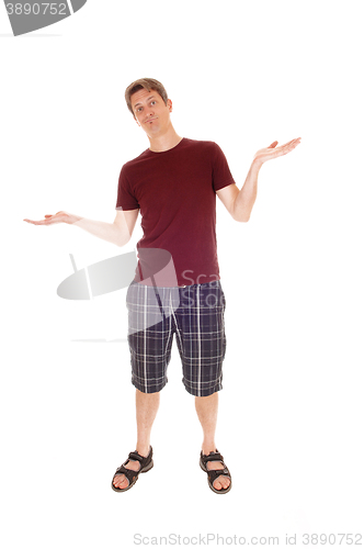 Image of Young man in shorts giving up.