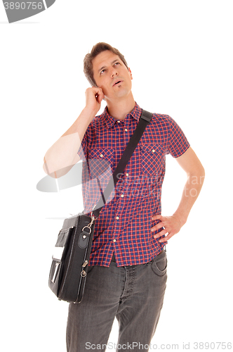 Image of Young man talking on phone.