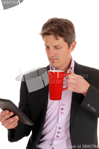 Image of Closeup of businessman with red mug.