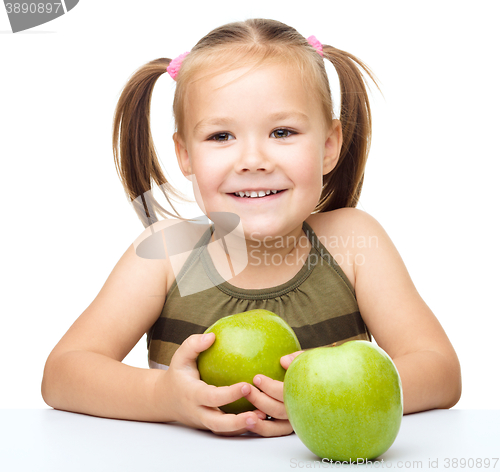 Image of Little girl with red apple
