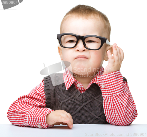 Image of Portrait of a cute little boy wearing glasses