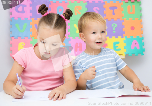 Image of Children are writing on their books