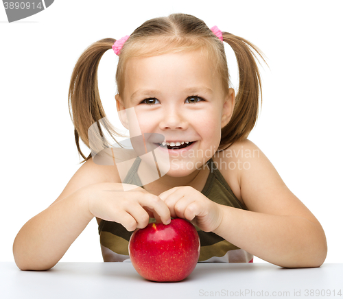 Image of Little girl with red apple