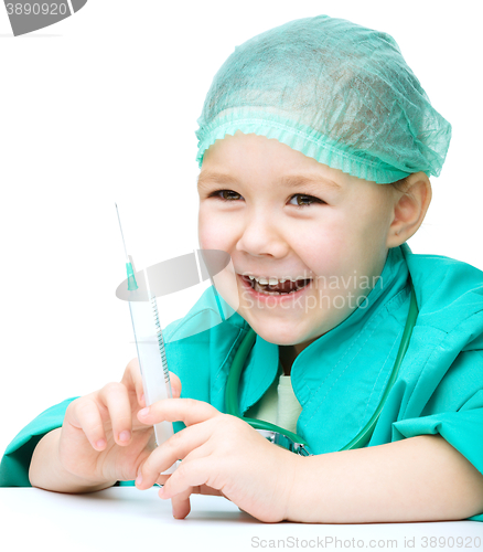 Image of Cute little girl is playing doctor with syringe
