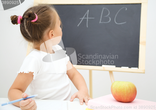 Image of Little girl is studying