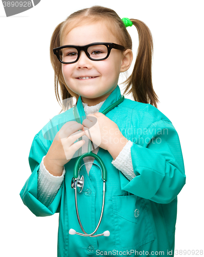 Image of Cute little girl is playing doctor