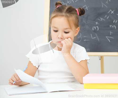 Image of Little girl is studying